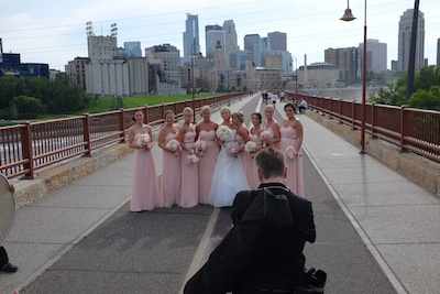 The Stone Arch Bridge is a popular spot for wedding shots.  Here's a group hoping the constant flow of goofball cyclists such as myself will die down for a minute.